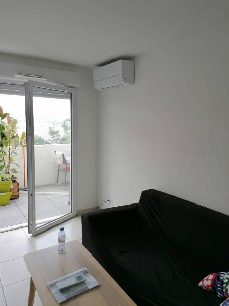 Installation de climatisation réversible salon appartement william booth caillols residence belvedere XI marseille generation confort